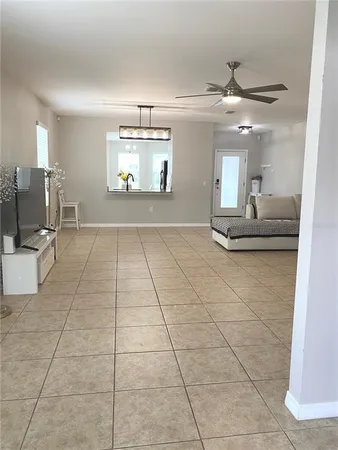 a living room with kitchen