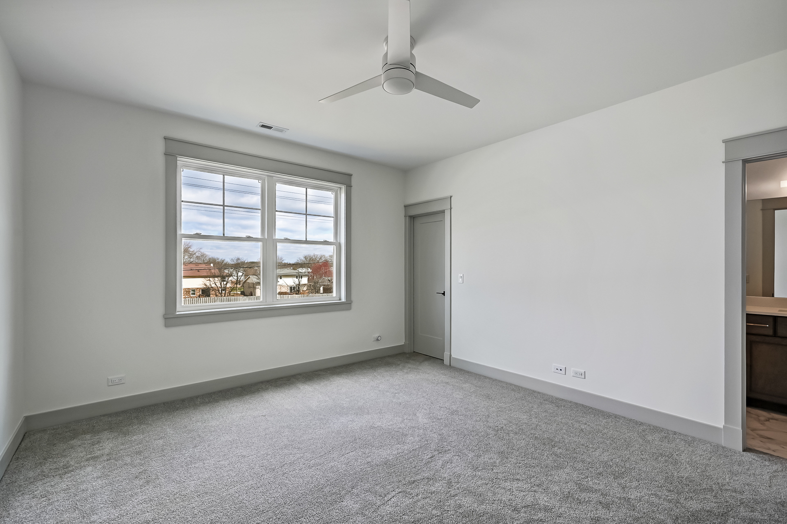 1205 Ridge Road Westmont, IL 60527 - Photo 16 of 25 an empty room with windows and ceiling fan