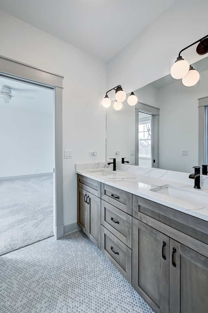 1205 Ridge Road Westmont, IL 60527 - Photo 19 of 25 a spacious bathroom with a granite countertop sink a mirror and a