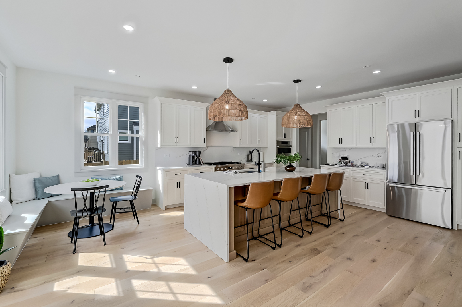 1205 Ridge Road Westmont, IL 60527 - Photo 4 of 25 a large kitchen with kitchen island a white cabinets and chairs