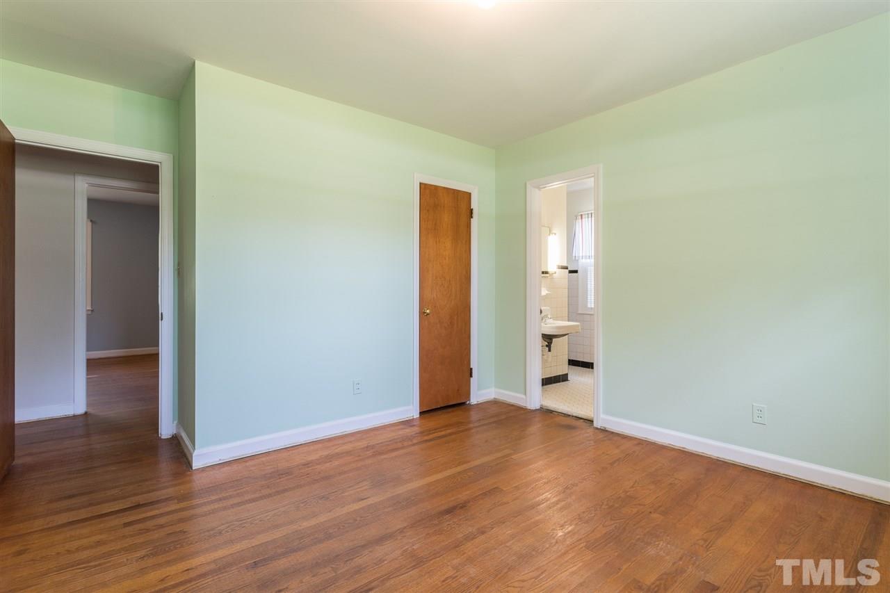 4929 Kaplan Drive Raleigh, NC 27606 - Photo 29 of 30 a view of empty room with wooden floor