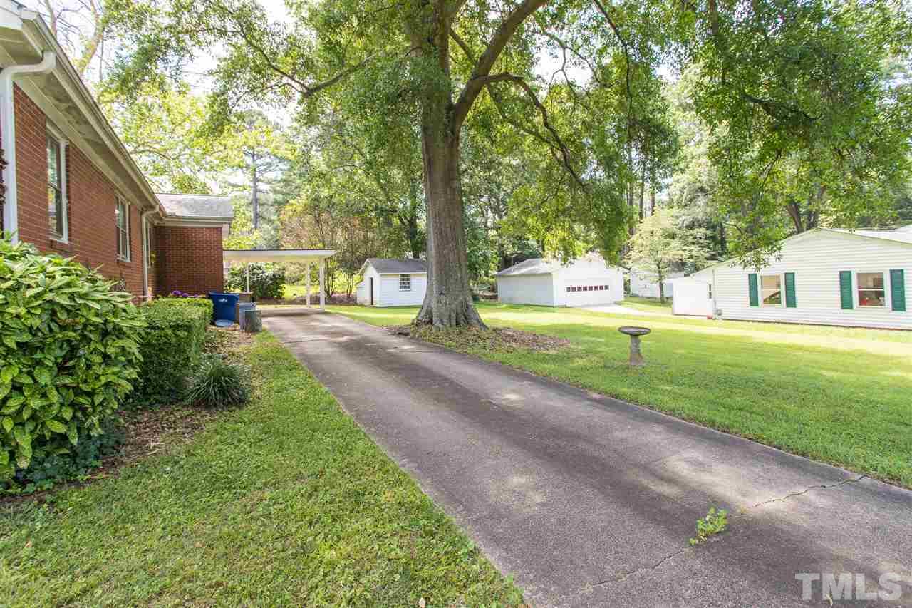 4929 Kaplan Drive Raleigh, NC 27606 - Photo 4 of 30 a house view with a garden space