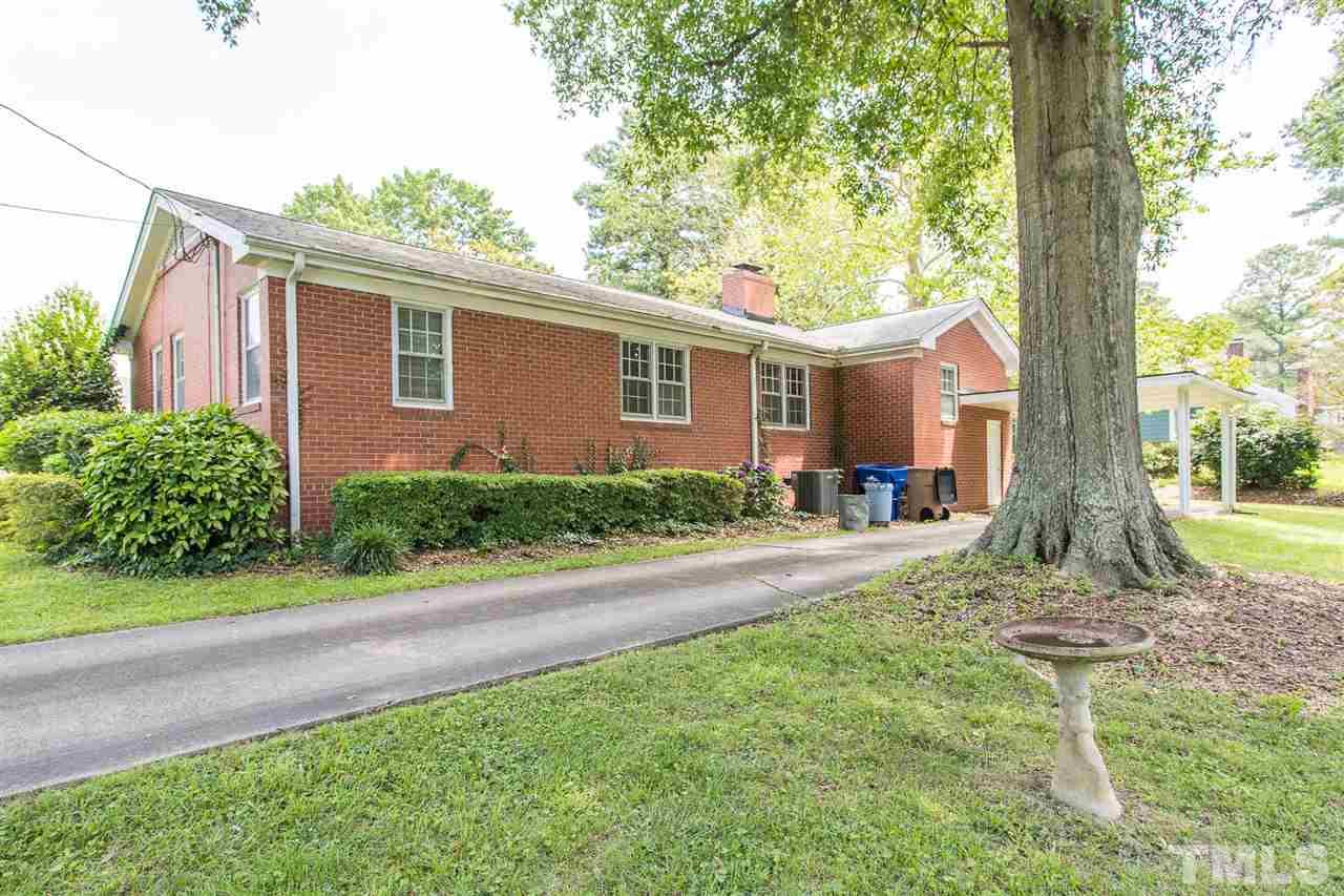 4929 Kaplan Drive Raleigh, NC 27606 - Photo 5 of 30 a front view of a house with garden
