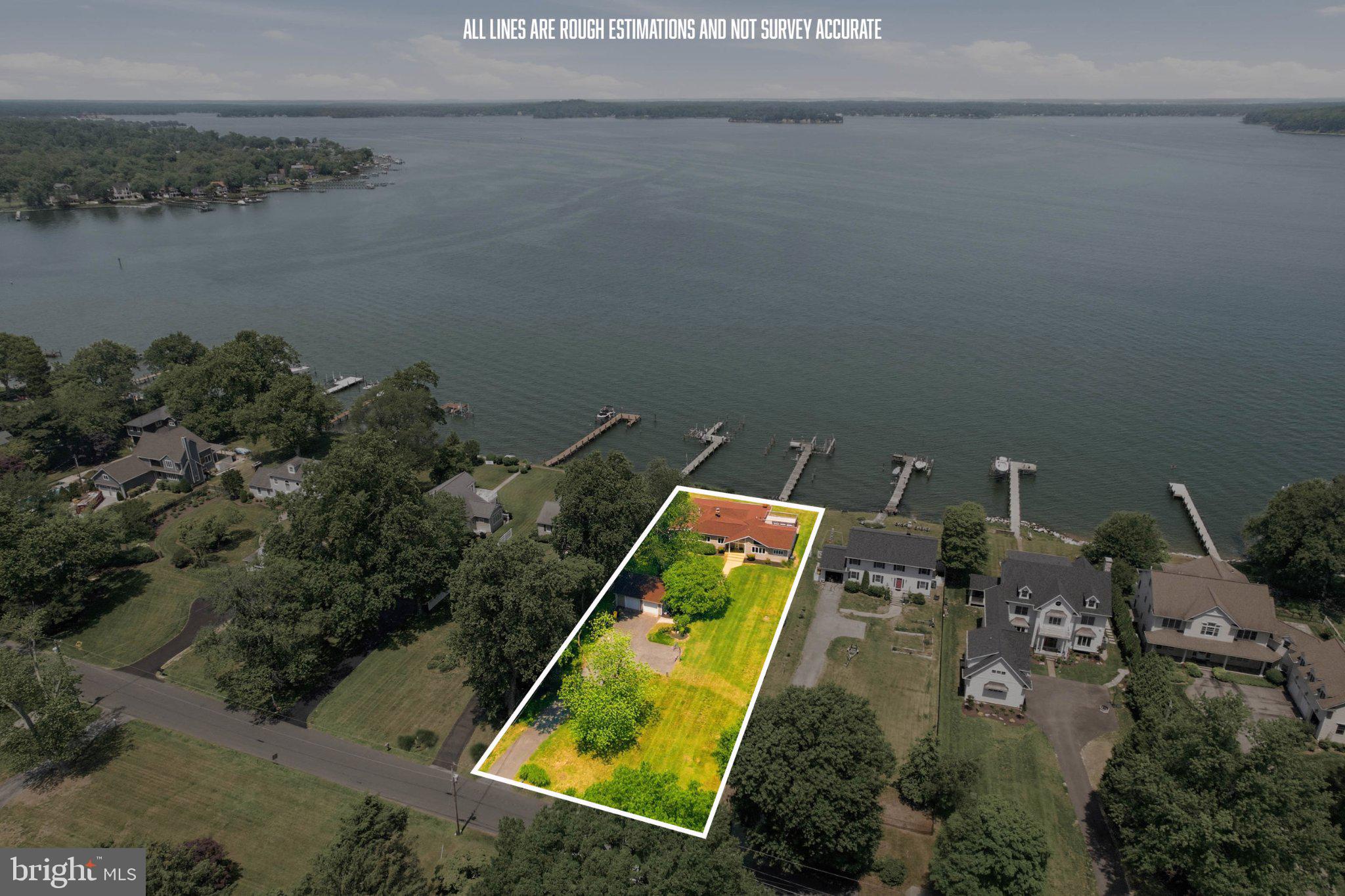 1100 River Bay Road Annapolis, MD 21409 - Photo 62 of 67 an aerial view of a house with a yard and lake view