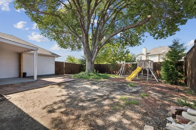a view of a backyard with a slide