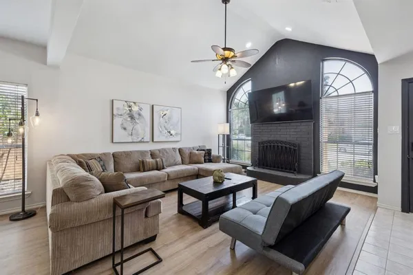 a living room with furniture and a fireplace