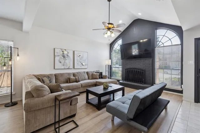 a living room with furniture and a fireplace
