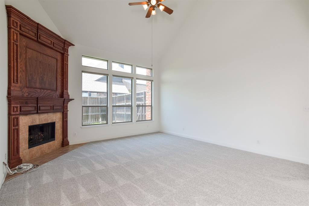 11007 Southwyck Drive Frisco, TX 75033 - Photo 11 of 36 a view of an empty room with a fireplace