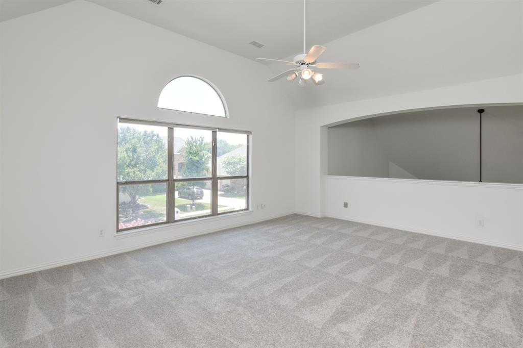 11007 Southwyck Drive Frisco, TX 75033 - Photo 19 of 36 an empty room with chandelier fan