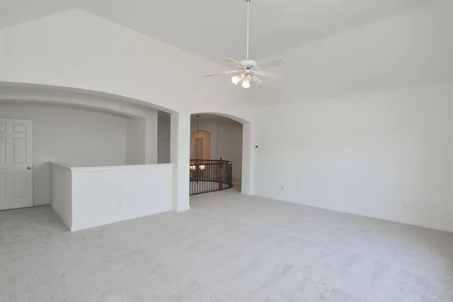 a view of empty room with fan