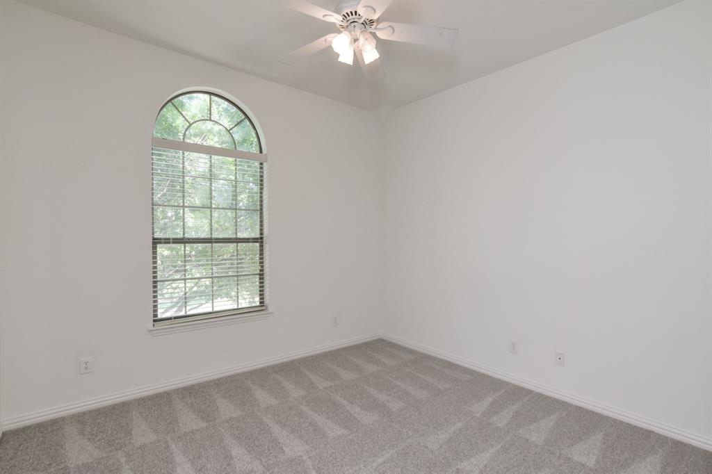 11007 Southwyck Drive Frisco, TX 75033 - Photo 28 of 36 an empty room with a window and a chandelier