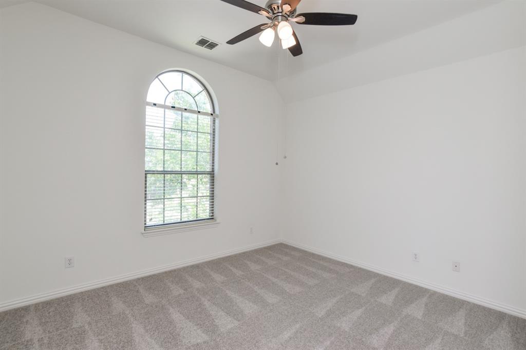 11007 Southwyck Drive Frisco, TX 75033 - Photo 31 of 36 an empty room with a window and a fan