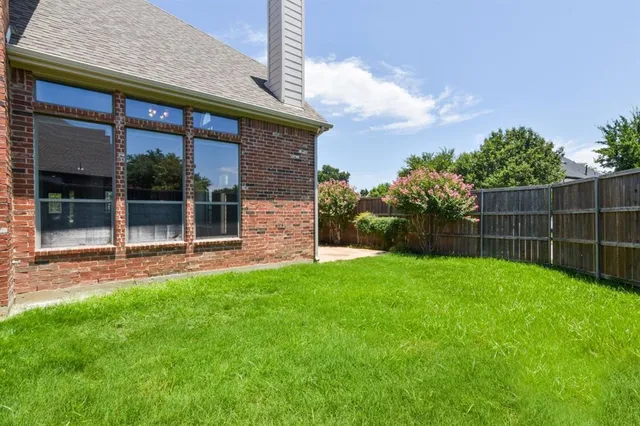 a view of a backyard with a garden