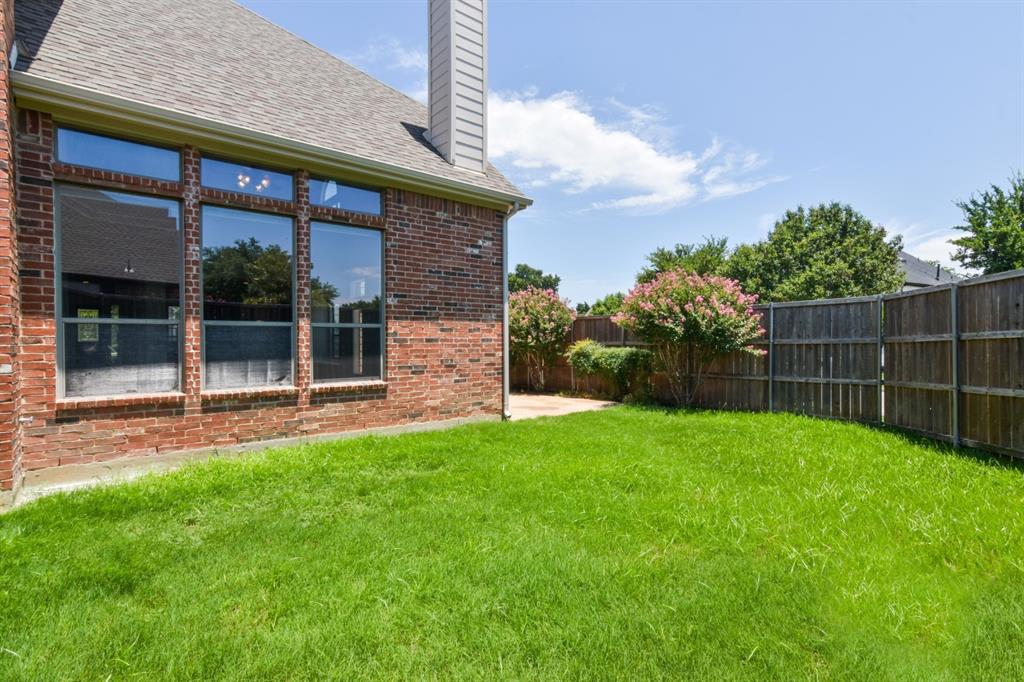 11007 Southwyck Drive Frisco, TX 75033 - Photo 35 of 36 a view of a backyard with a garden