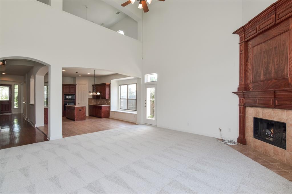 11007 Southwyck Drive Frisco, TX 75033 - Photo 10 of 36 a view of an empty room with a fireplace