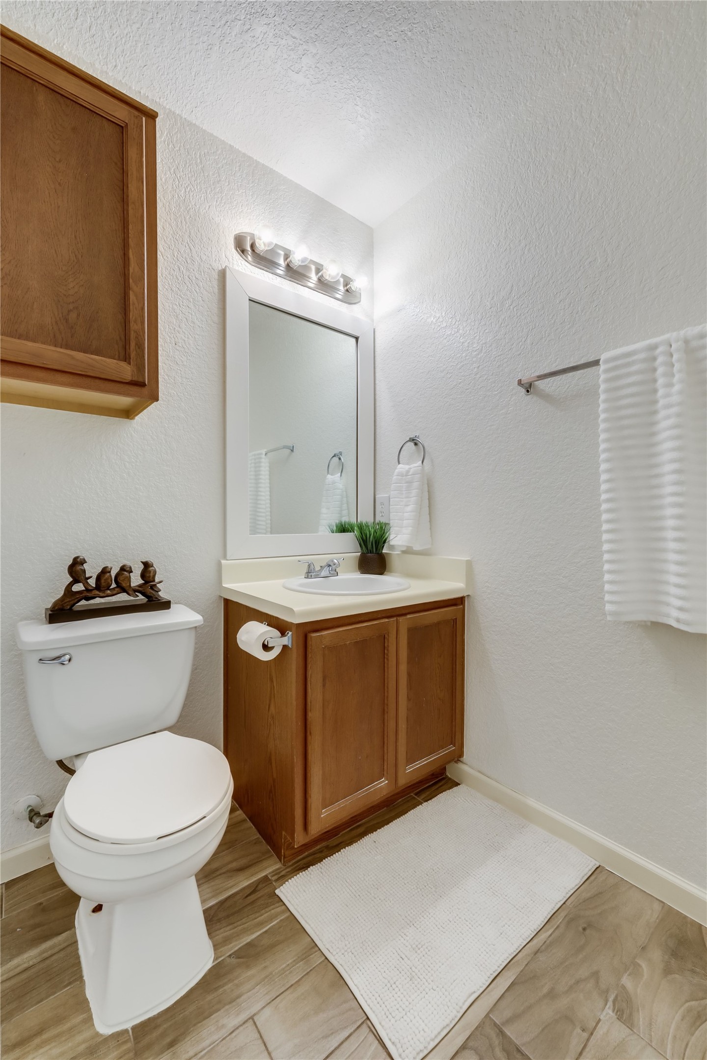 4510 Secure Lane Austin, TX 78725 - Photo 17 of 24 a bathroom with a toilet sink and mirror