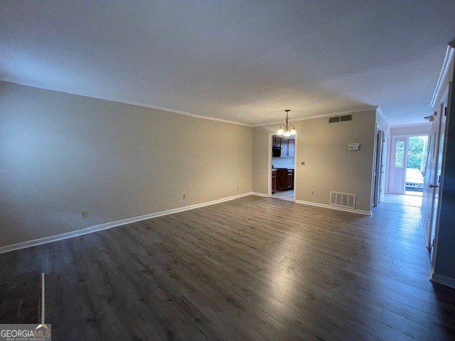 710 Stratford Green Avondale Estates, GA 30002 - Photo 3 of 9 an empty room with wooden floor & windows