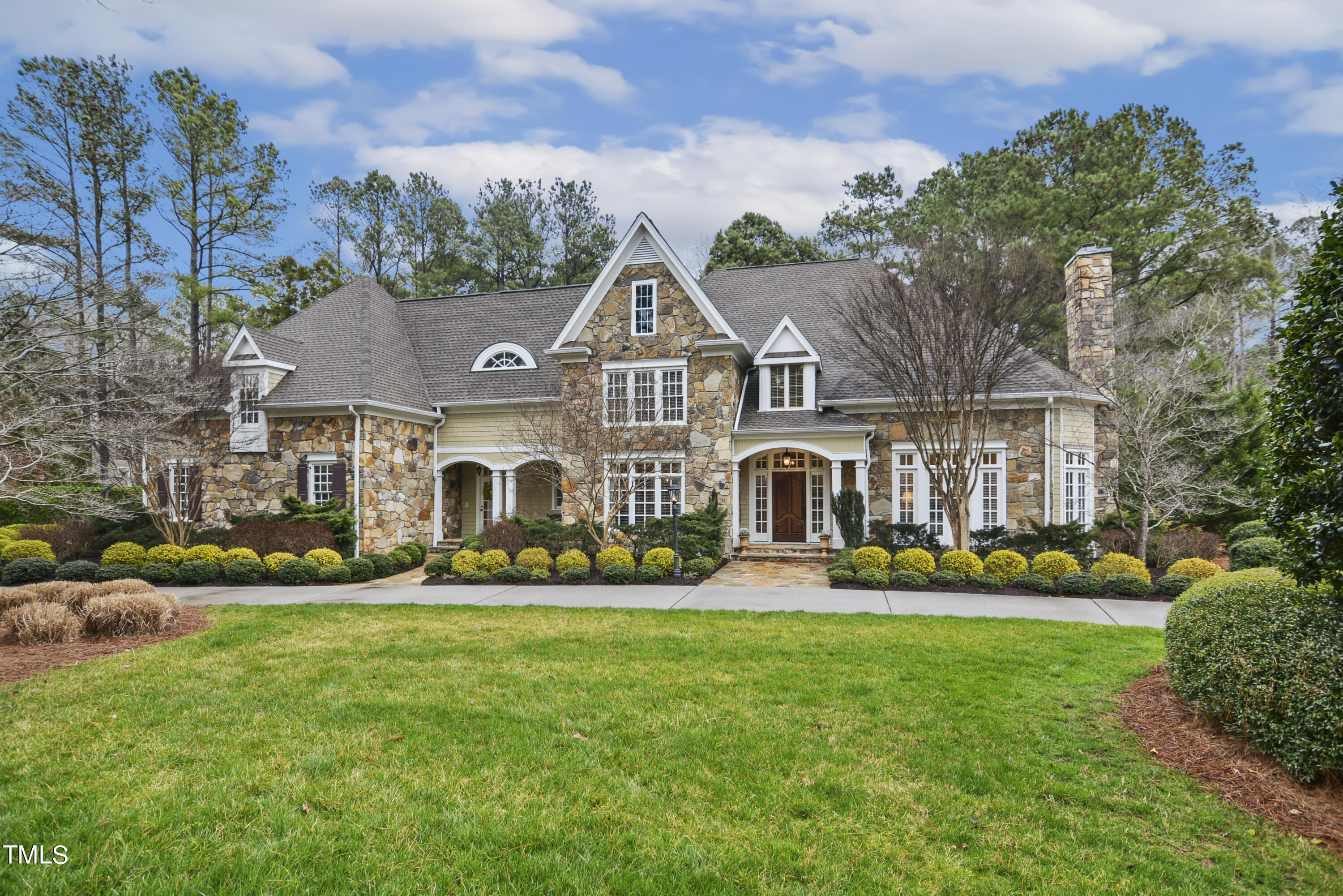 11004 Brass Kettle Road Raleigh, NC 27614 - Photo 1 of 57 a front view of a house with a yard and potted plants