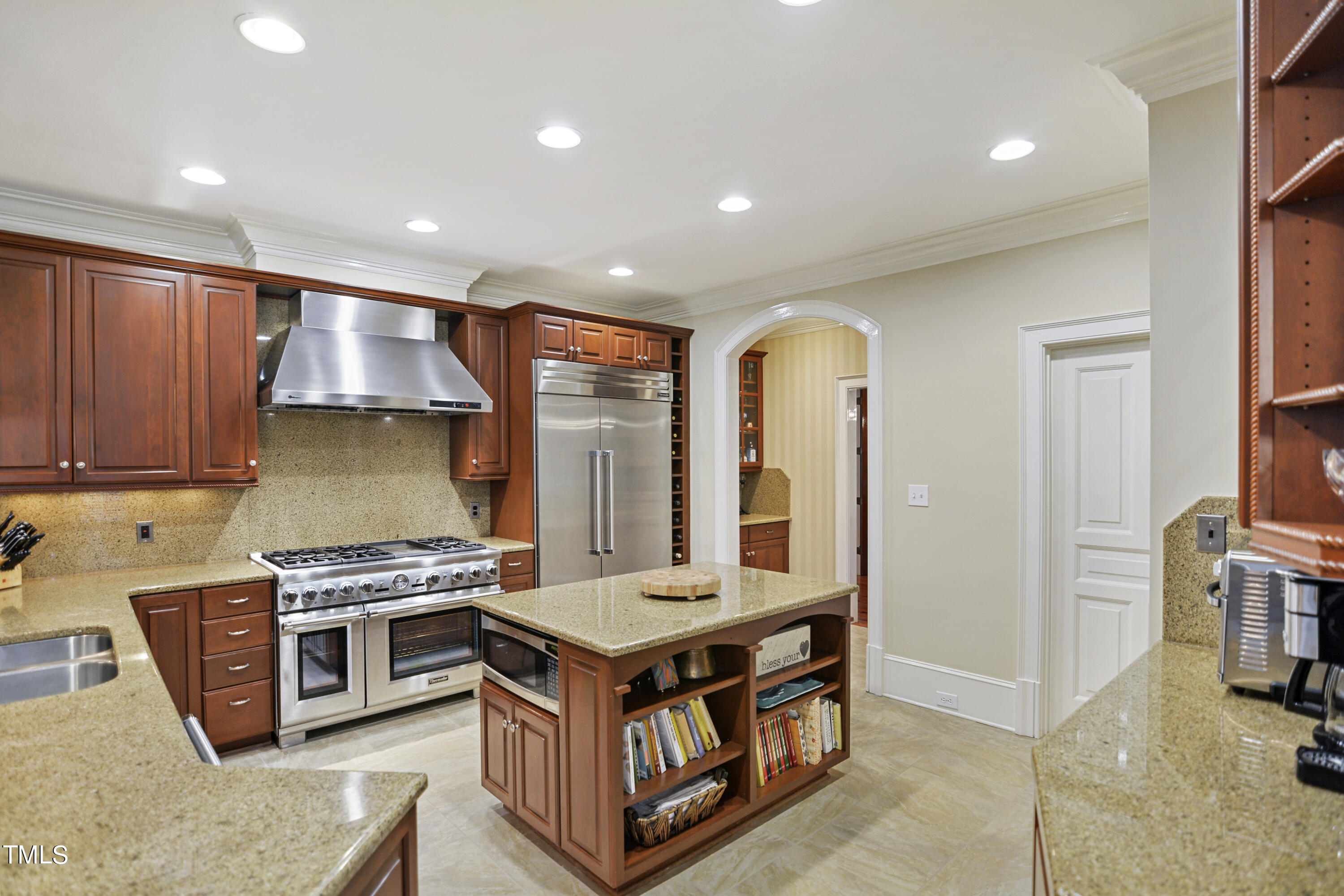 11004 Brass Kettle Road Raleigh, NC 27614 - Photo 14 of 57 a kitchen with stainless steel appliances granite countertop a stove and a refrigerator