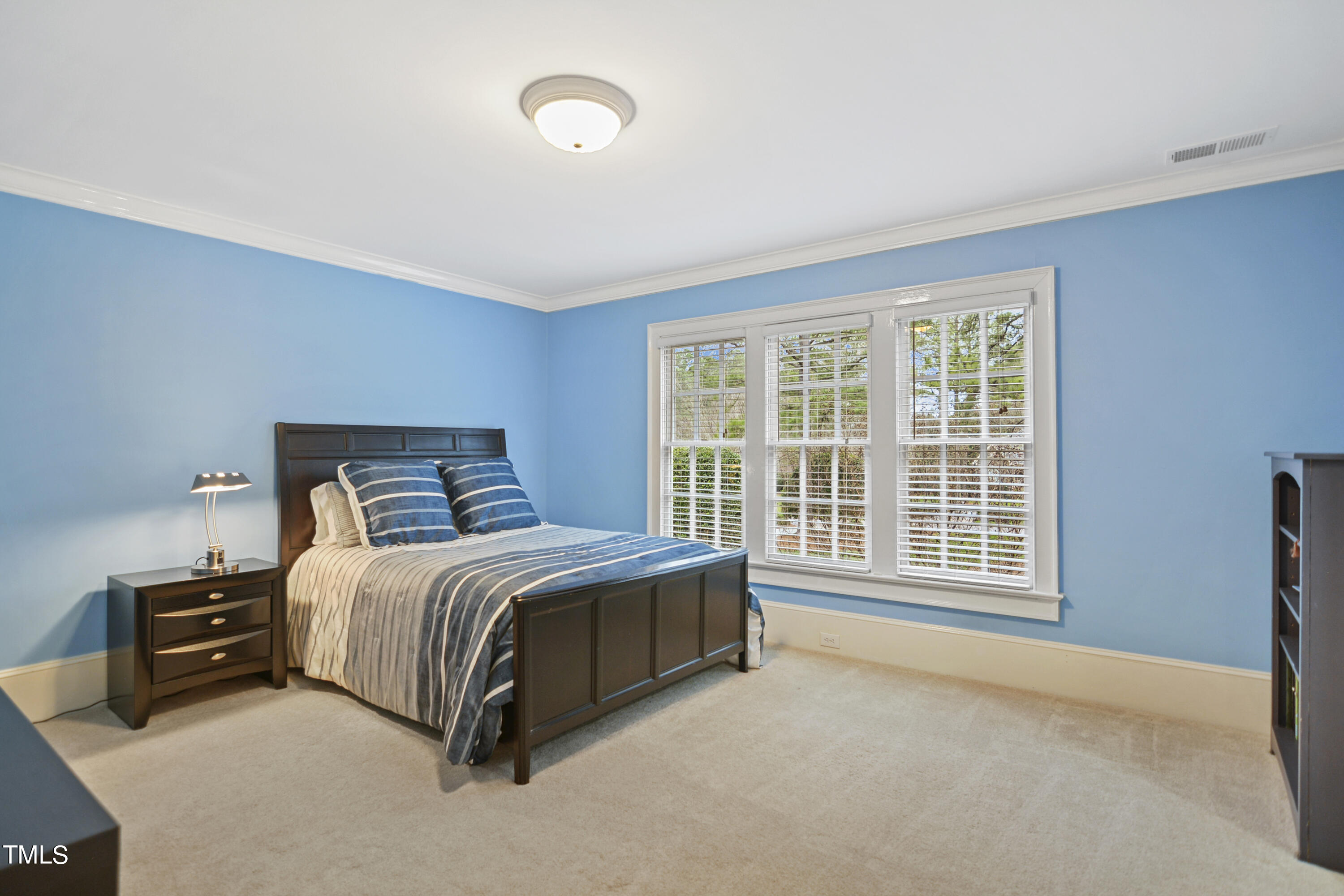 11004 Brass Kettle Road Raleigh, NC 27614 - Photo 28 of 57 a spacious bedroom with a bed and a window