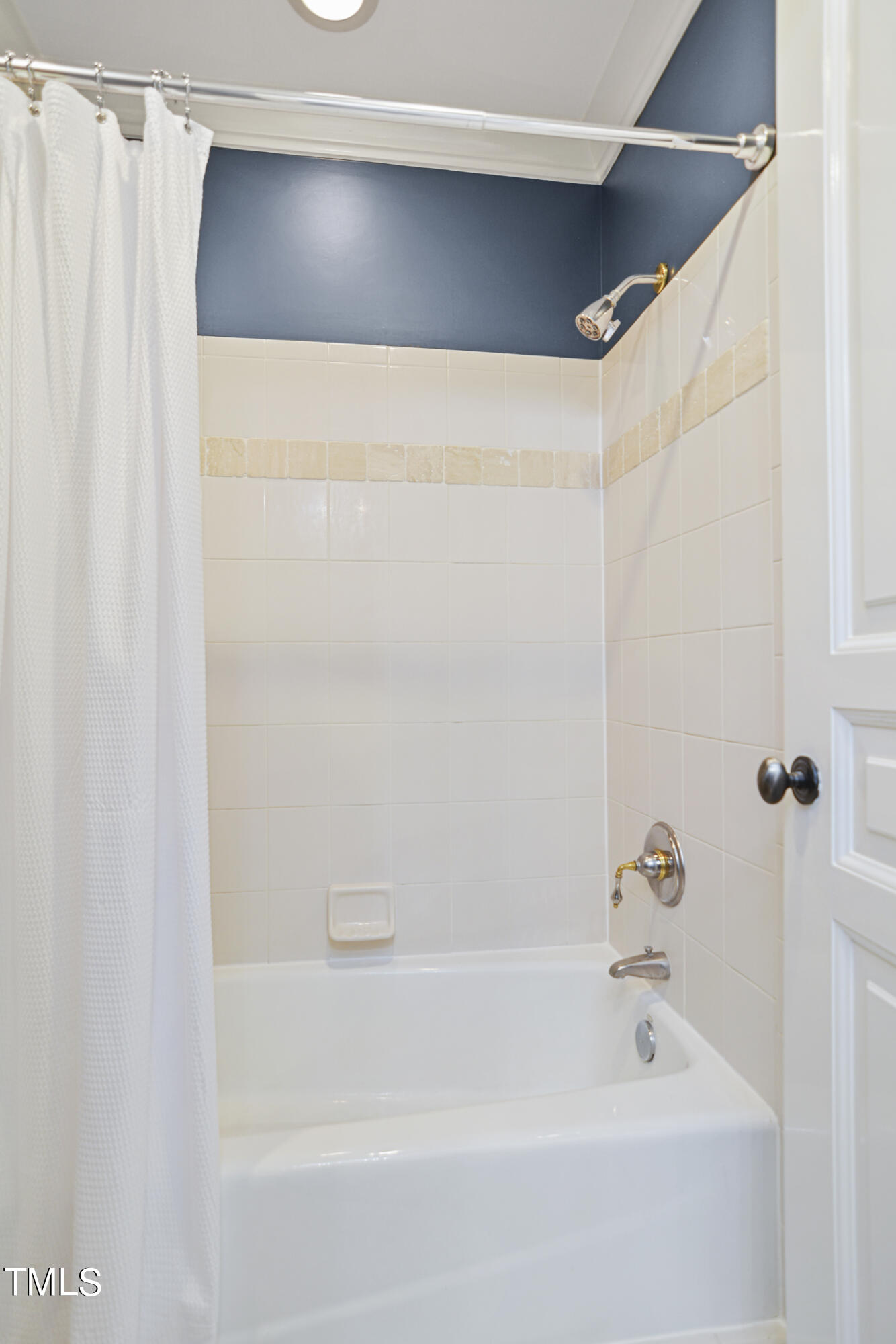 11004 Brass Kettle Road Raleigh, NC 27614 - Photo 30 of 57 a bathroom with a shower and a bathtub