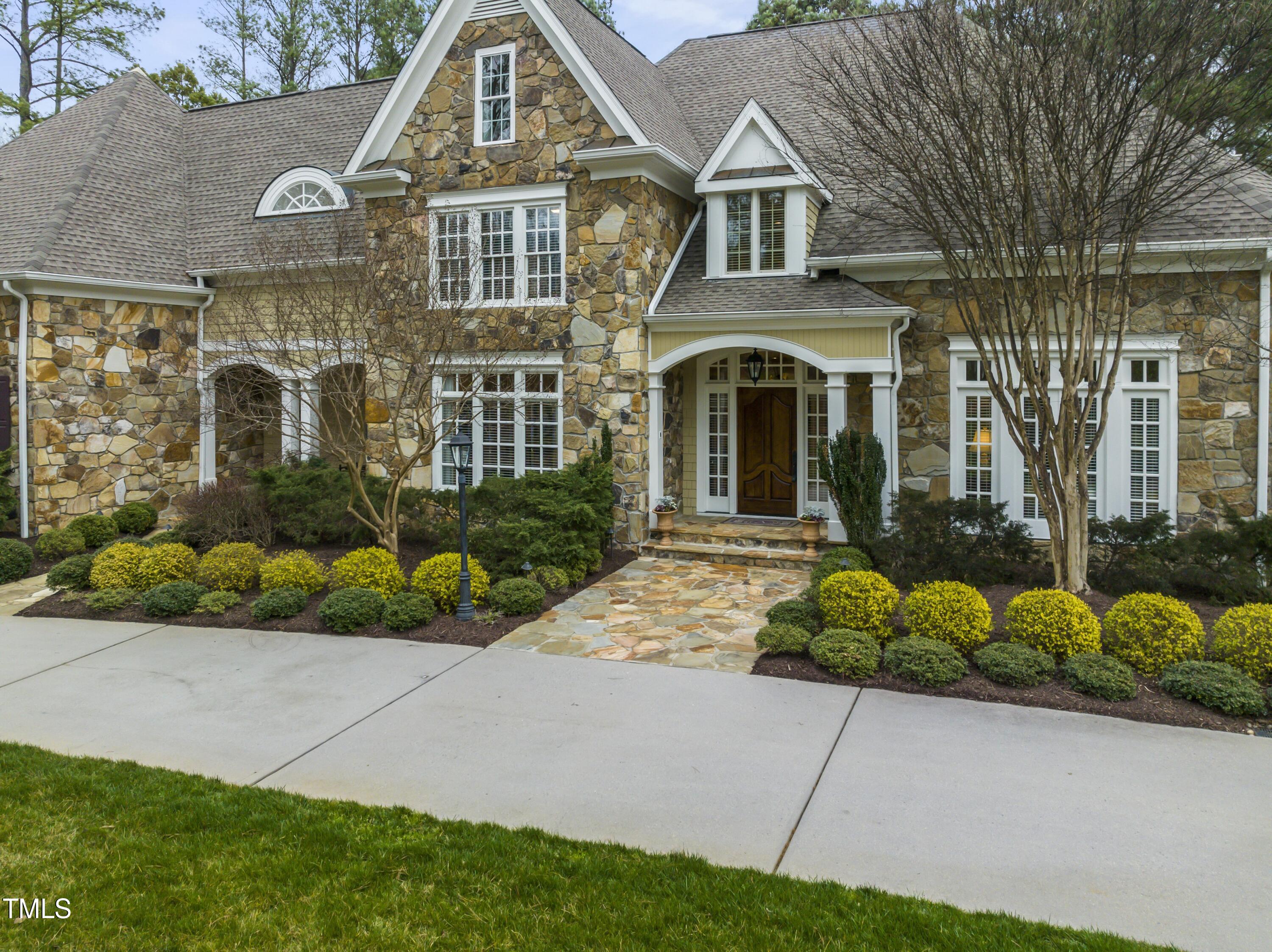 11004 Brass Kettle Road Raleigh, NC 27614 - Photo 3 of 57 a front view of a house with a garden