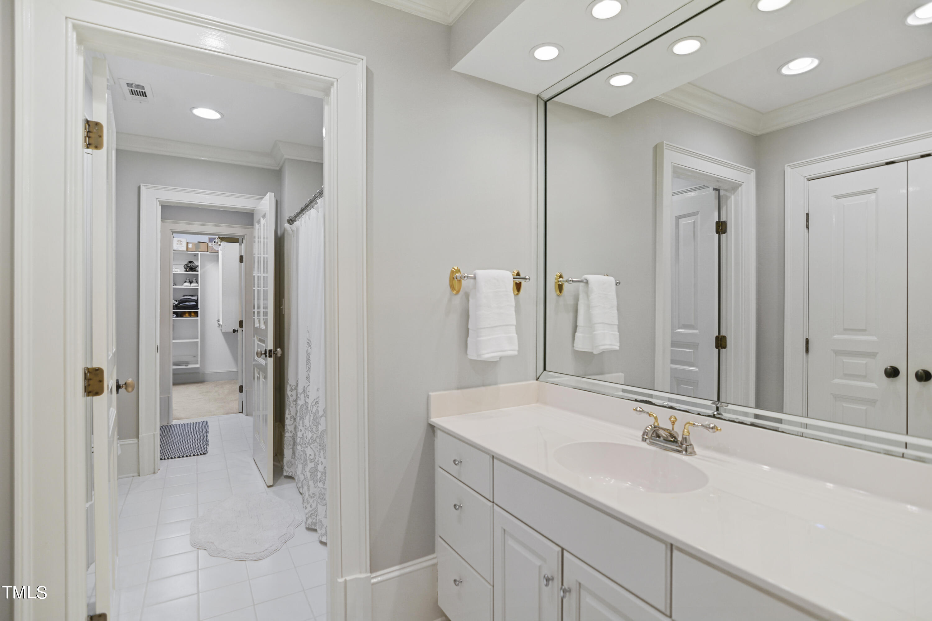 11004 Brass Kettle Road Raleigh, NC 27614 - Photo 33 of 57 a bathroom with a sink and mirror