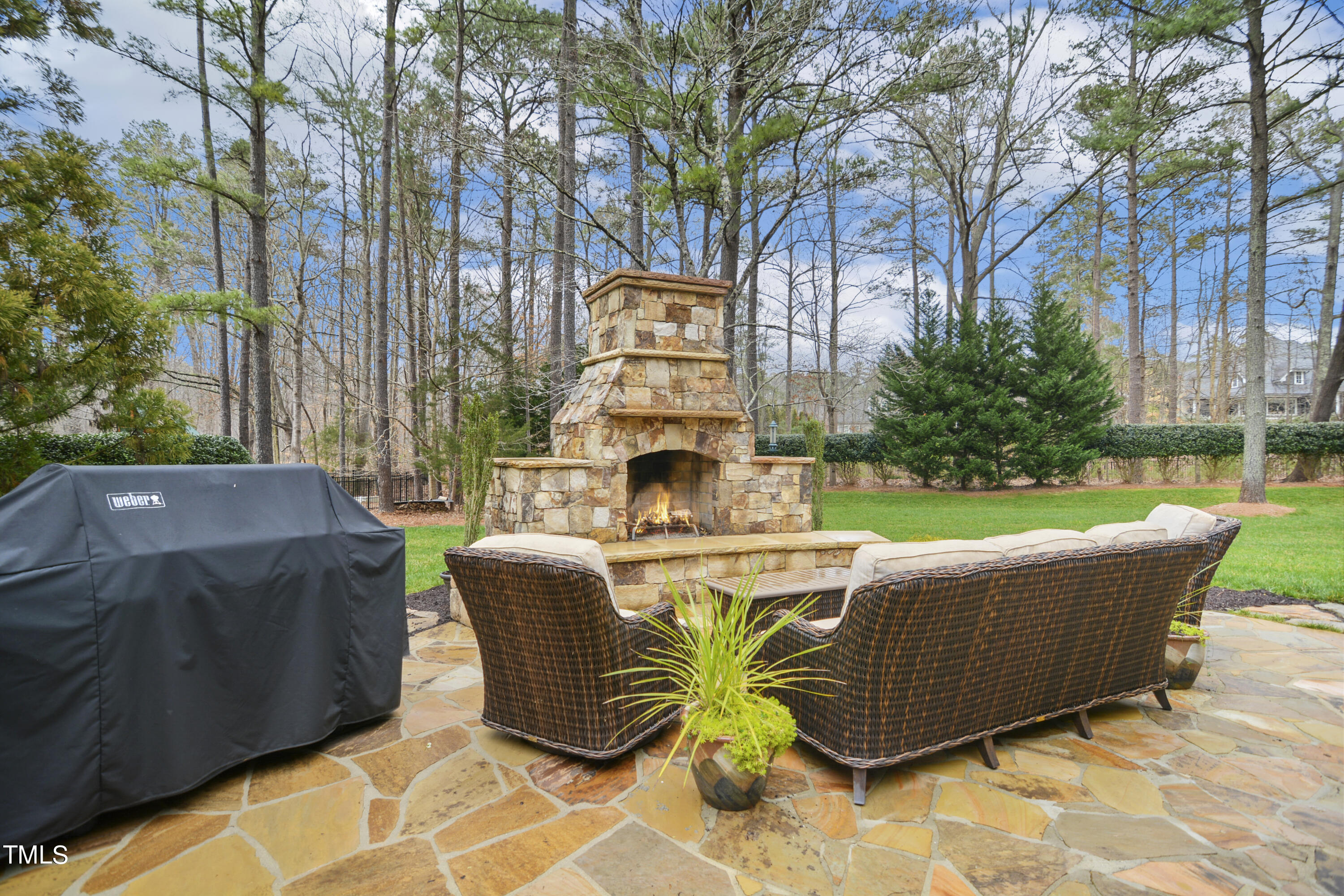 11004 Brass Kettle Road Raleigh, NC 27614 - Photo 46 of 57 a view of a swimming pool with couches chairs and wooden floor