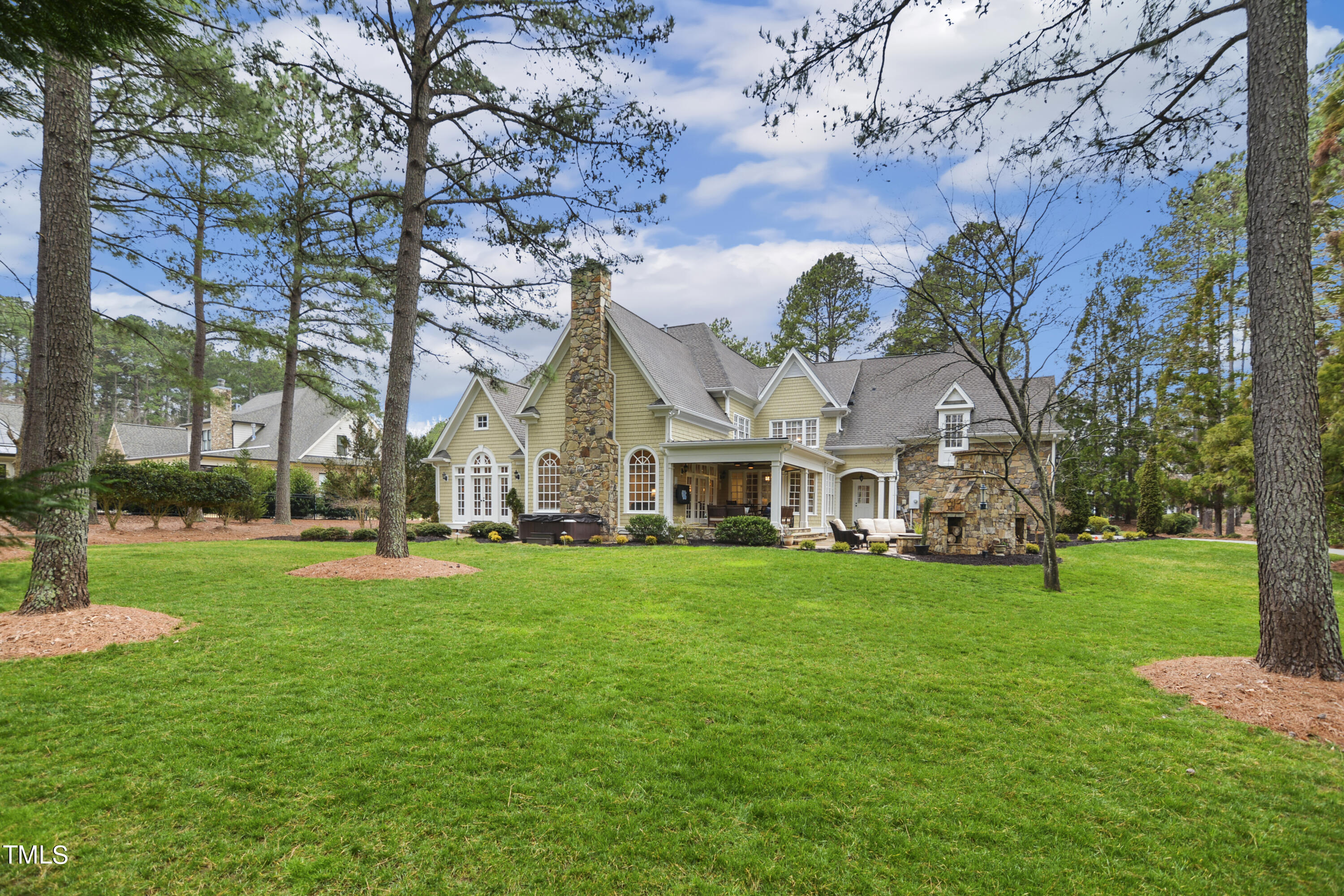 11004 Brass Kettle Road Raleigh, NC 27614 - Photo 51 of 57 a view of a white house in front of a big yard with large trees
