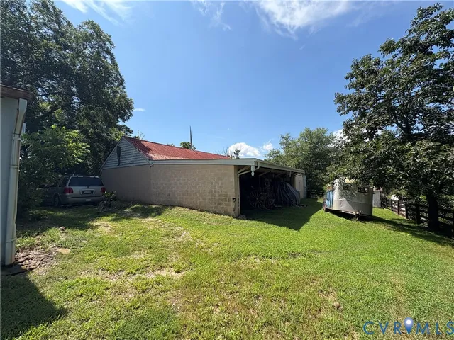 a view of a backyard with a small cabin