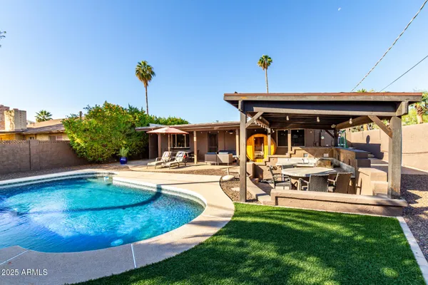 a view of a swimming pool with a patio