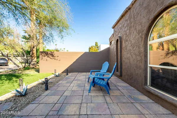 a swimming pool with outdoor seating and yard