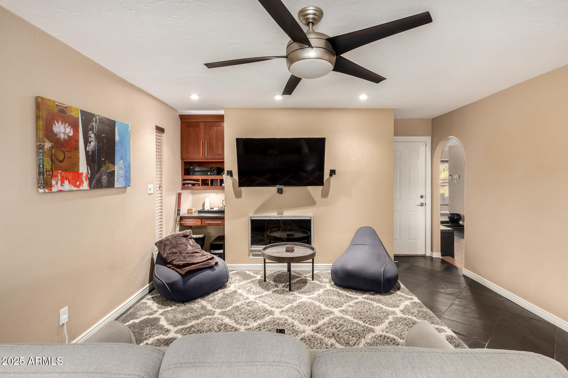 5319 North 15th Street Phoenix, AZ 85014 - Photo 6 of 30 a living room with fireplace furniture and a flat screen tv