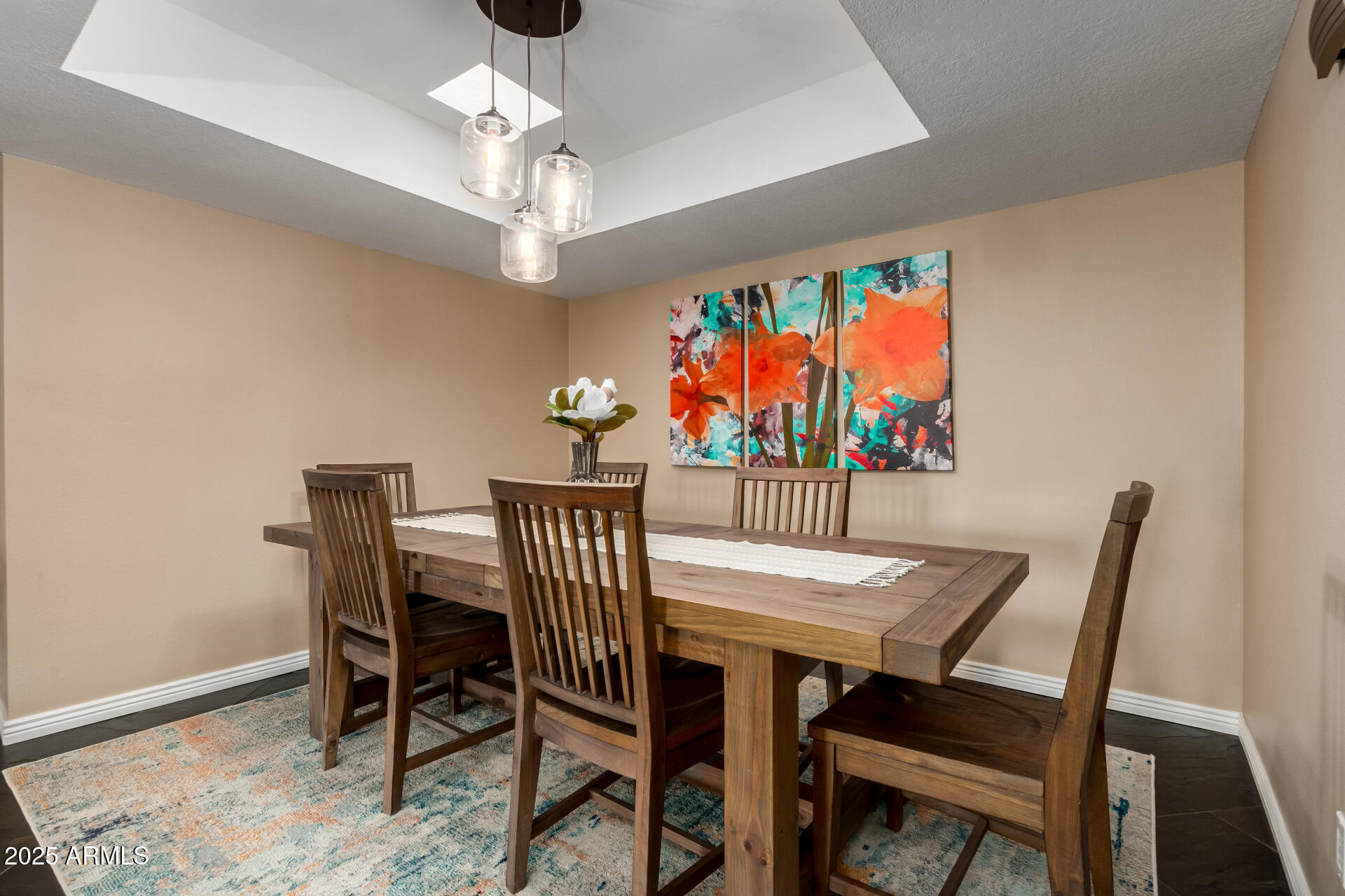 5319 North 15th Street Phoenix, AZ 85014 - Photo 7 of 30 a view of a dining room with furniture a chandelier and wooden floor