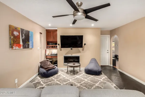 a view of a dining room with furniture a chandelier and wooden floor