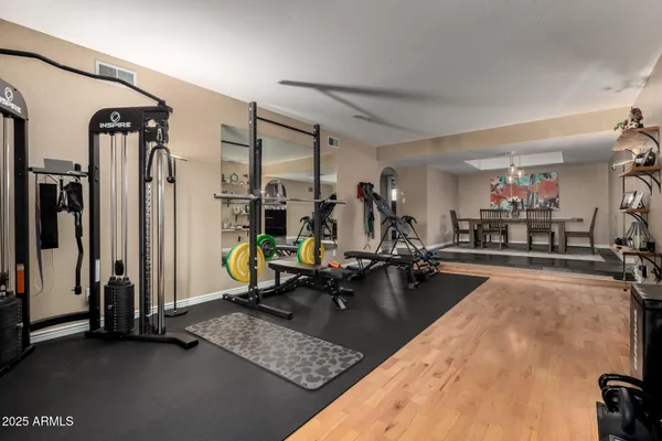 a room with gym equipment and a large window
