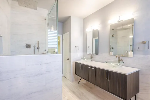 a bathroom with a double vanity sink mirror and double