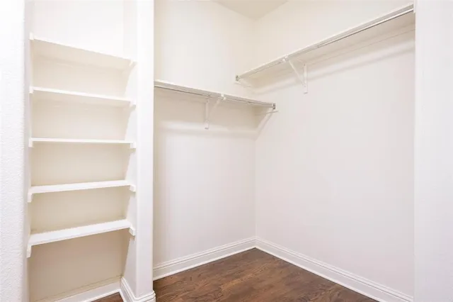 a view of an empty walk in closet