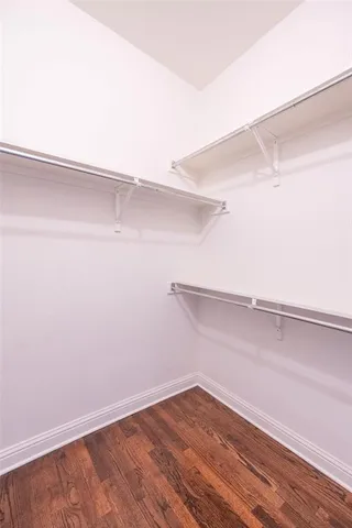 a view of an empty walk in closet