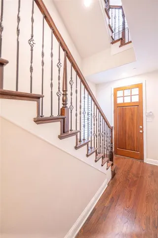 a view of staircase with railing and a floor to ceiling window