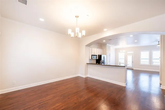 a view of a kitchen with a sink and a window