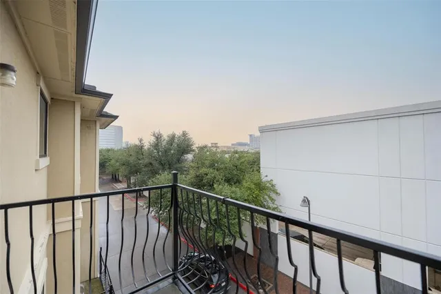 a view of balcony with wooden floor