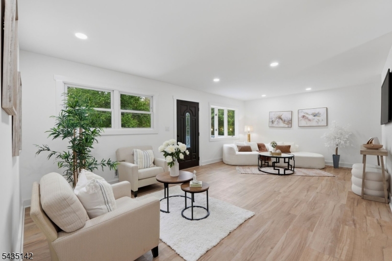 36 Ruth Street Hopatcong, NJ 07874 - Photo 2 of 25 a living room with furniture and potted plants