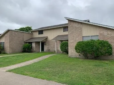 a view of a house with a garden