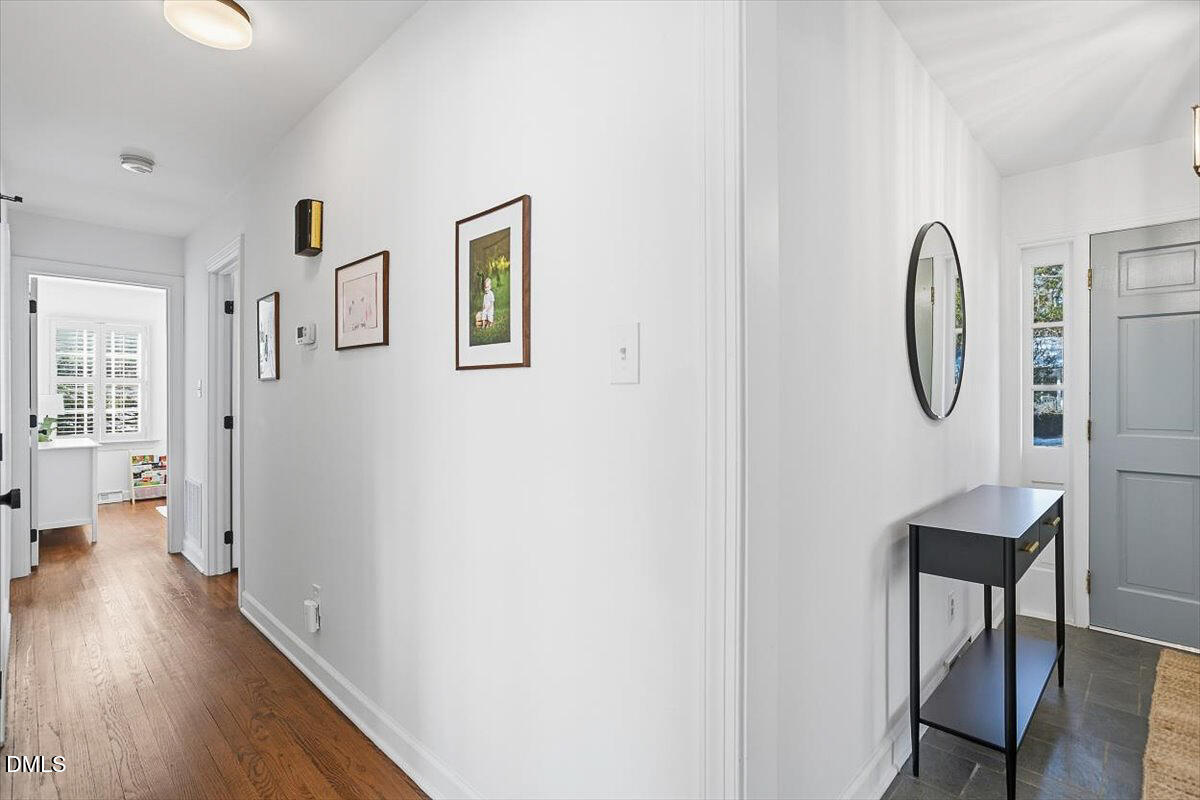 5904 Volant Drive Raleigh, NC 27609 - Photo 21 of 42 a view of a livingroom with furniture and wooden floor