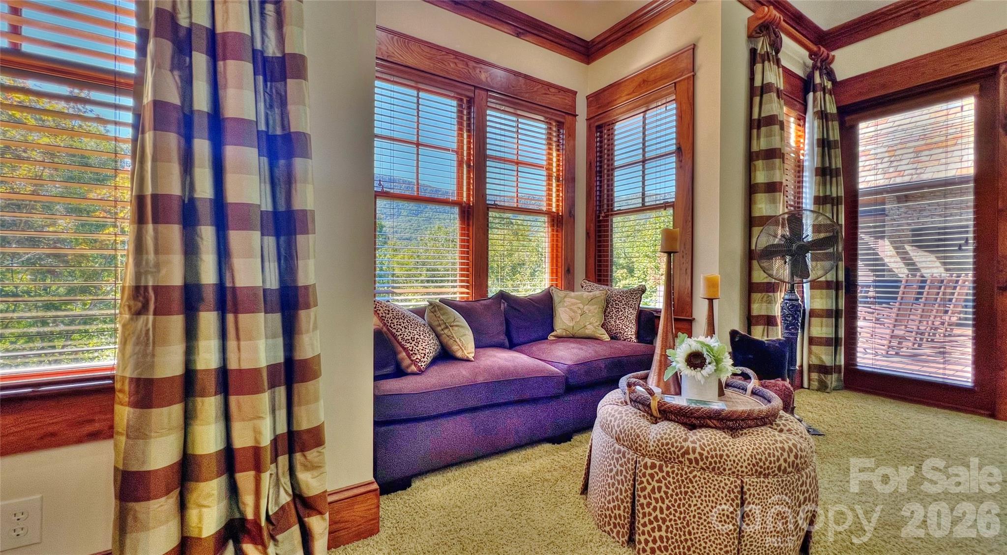 538 Chestertown Drive Mill Spring, NC 28756 - Photo 16 of 48 a living room with furniture and a floor to ceiling window