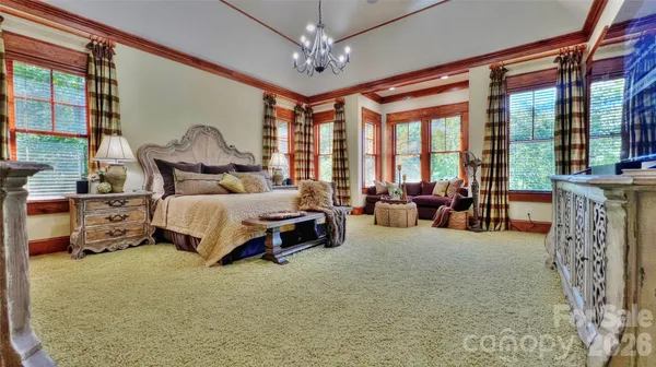 a bedroom with a bed and a couch