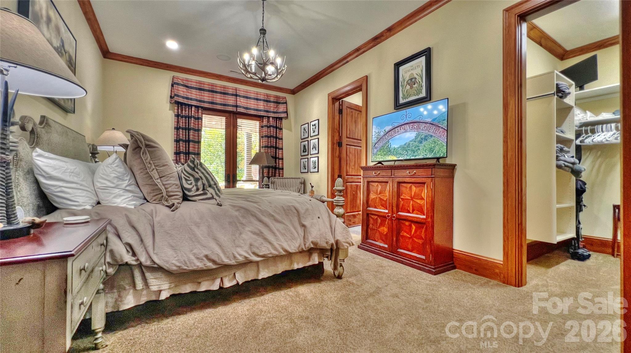 538 Chestertown Drive Mill Spring, NC 28756 - Photo 21 of 48 a spacious bedroom with a bed and a flat screen tv