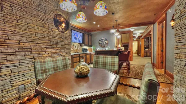 a kitchen with a stove a sink and cabinets