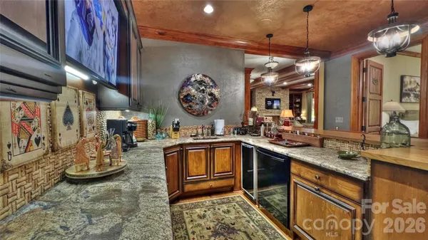 a bathroom with a sink a mirror and a shower